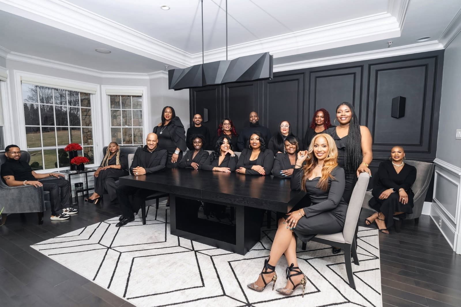 The Synergy Group of eXp Realty team around the table